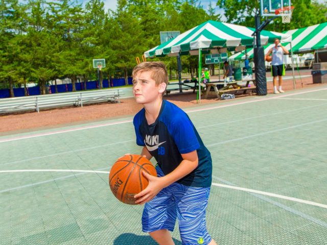 Camper playing basketball