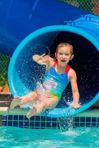 Girl going down waterslide